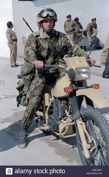 a-british-army-soldier-on-a-motorcycle-during-the-persian-gulf-war-DWJWBY.jpeg